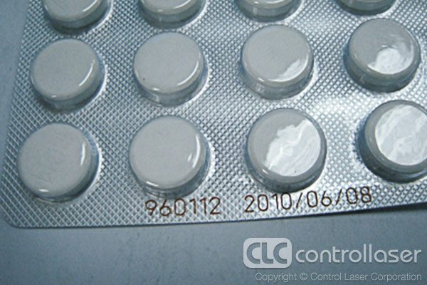 Laser marking plastic pill packaging with date code